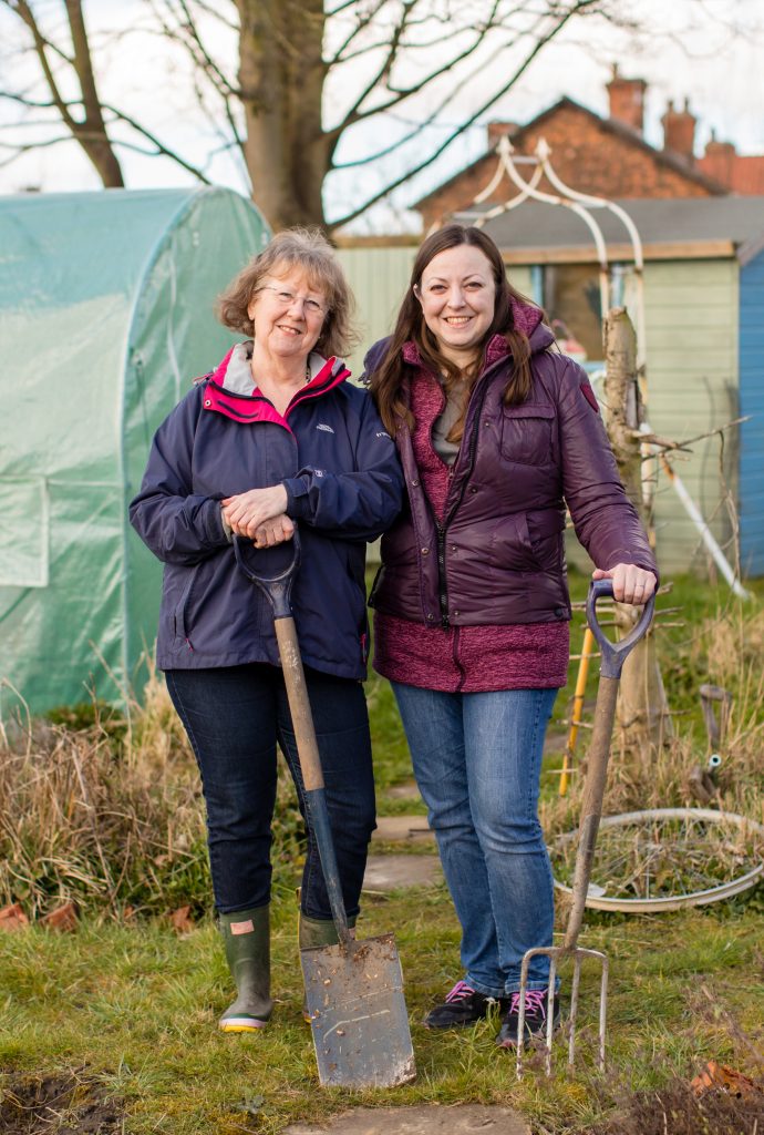 Two allotmeteers standing side by side at Recreation mRoad allotments